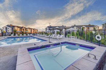 Resort inspired pool and spa with seating